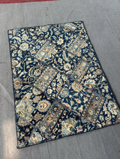 Decorative rug with intricate patterns on a gray floor- Luxury Forty-pices carpet Handmade Persian Carpet | Handmade in Iran – Vintage | Luxury Living Room Décor