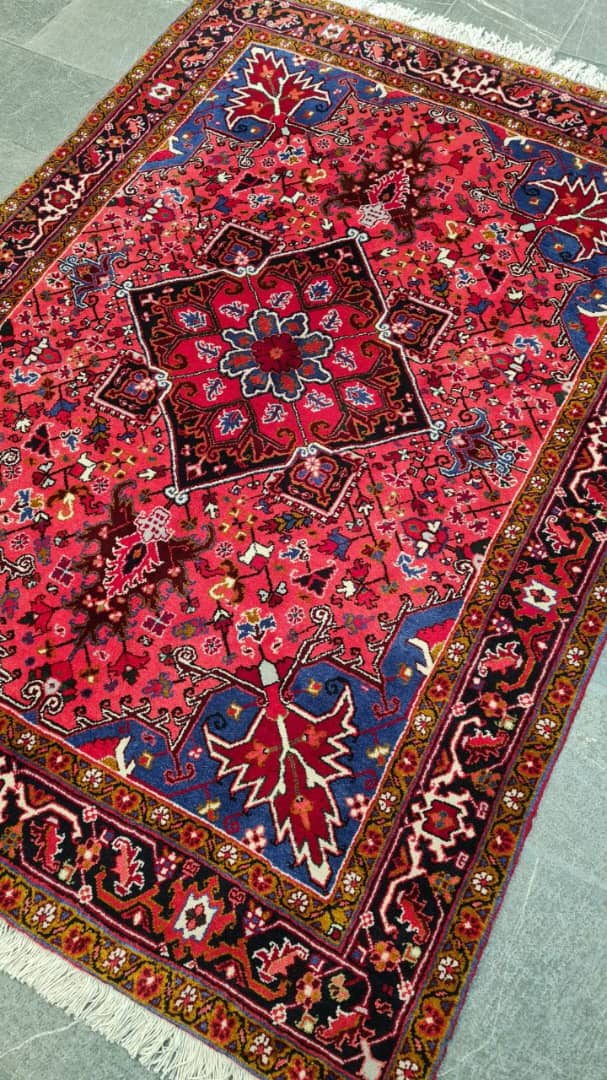 Decorative red and blue patterned rug on a light gray floor- Luxury Rug Handmade Oriental Rug | Handmade in Afghanistan – Bergamot | Luxury Living Room Décor