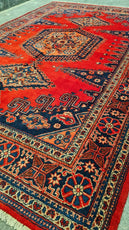 Decorative red and blue patterned rug with intricate designs= Luxury Rug Handmade Persian Rug | Handmade in Iran – Bergamot | Luxury Living Room Décor