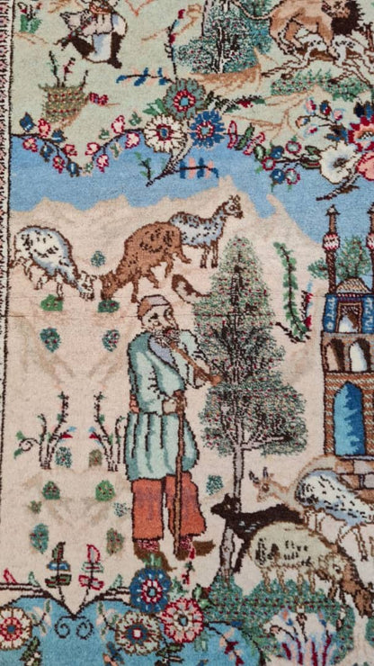 Decorative rug with intricate patterns of animals, buildings, and a person holding a staff- Luxury Rug Handmade Persian Rug | Handmade in Iran – C-7 | Luxury Living Room Décor