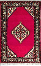 Decorative rug with a pink center and intricate border design.