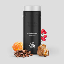 Black diffuser aroma bottle labeled 'Manhattan Coffee' by Dr. Scent with coffee beans, orange, and amber on a light gray background.