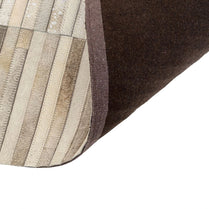 Close-up of a textured surface with horizontal stripes in brown, beige, and gray.