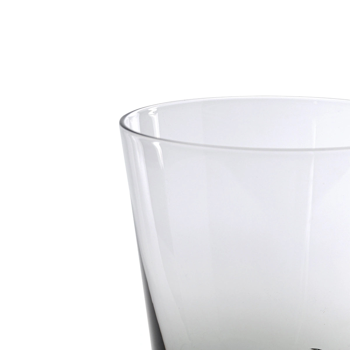 Clear glass tumbler on a white background
