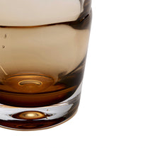 Close-up of a glass with a drink on a white background