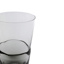 Clear glass tumbler on a white background