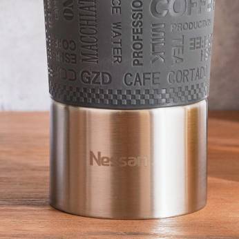 Nespresso coffee pod on a wooden surface