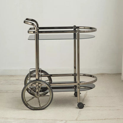 Metallic bar cart with glass shelves on a light wooden floor-  Notica Serving Trolley - Metal & Glass 81cm