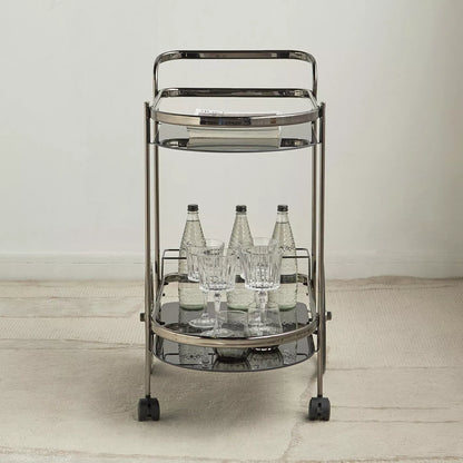 Metal bar cart with bottles and glasses on a neutral background-  Notica Serving Trolley - Metal & Glass 81cm