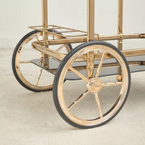 Gold cart with large wheels on a light background- Notica Serving Trolley- Metal & Glass, 81cm