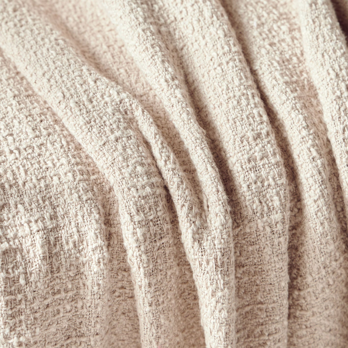 Close-up of beige textured fabric