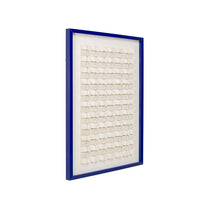 Decorative wall art with a blue frame and white mosaic design on a white background