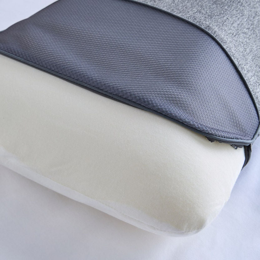 Close-up of a gray and white pillow with textured surface