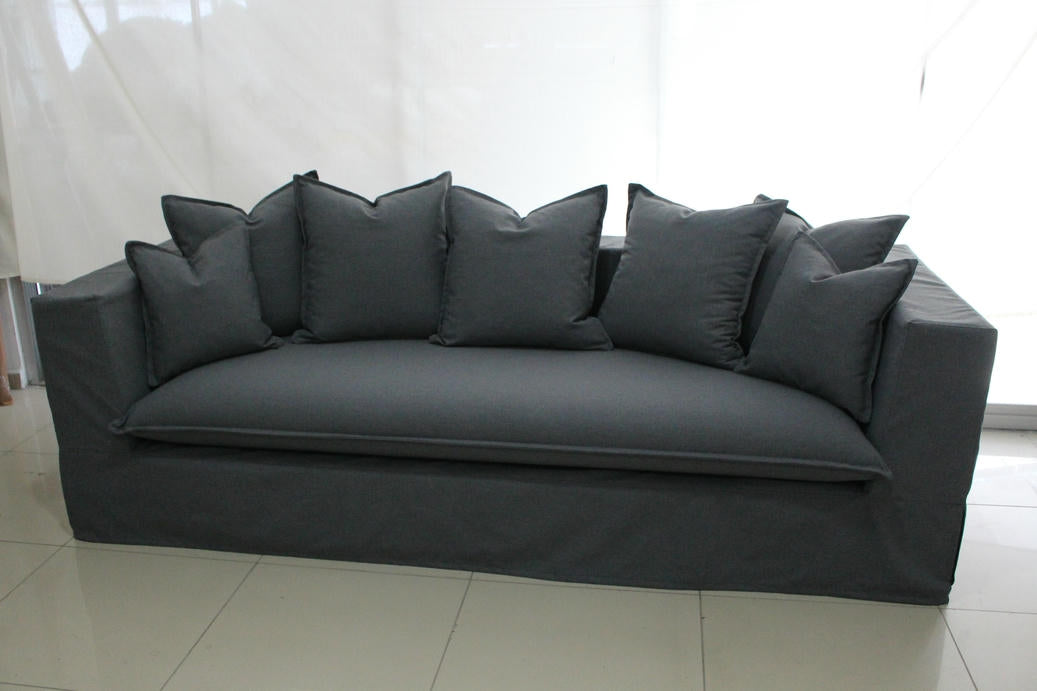 Gray sofa with multiple cushions on a white background. Paris Collection Sofa – Classic Elegance Reimagined | Vella Concept