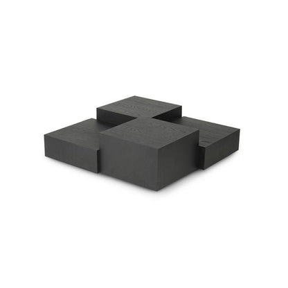 Black geometric sculpture on a white background