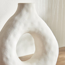 Close-up of a white abstract sculpture with a smooth texture.