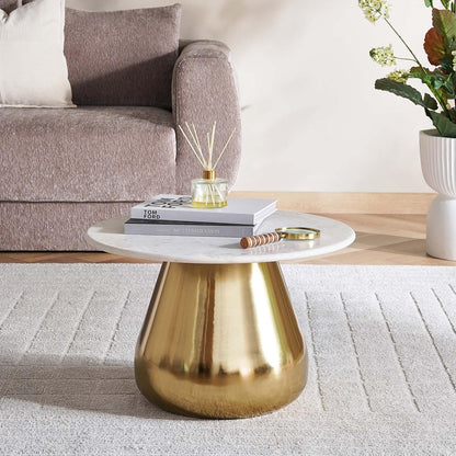 Coffee table with gold base and white top in a living room setting