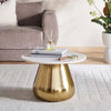 Gold and white coffee table in a living room setting with books and a diffuser- Porada Coffee Table – White Marble Top with Gold Base