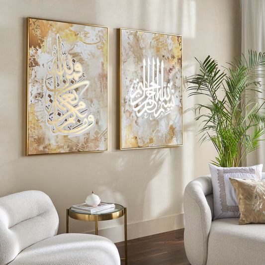 Two abstract art pieces on a wall in a living room with a couch and plant.