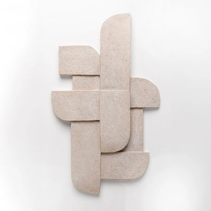Beige woven wall art piece on a white background