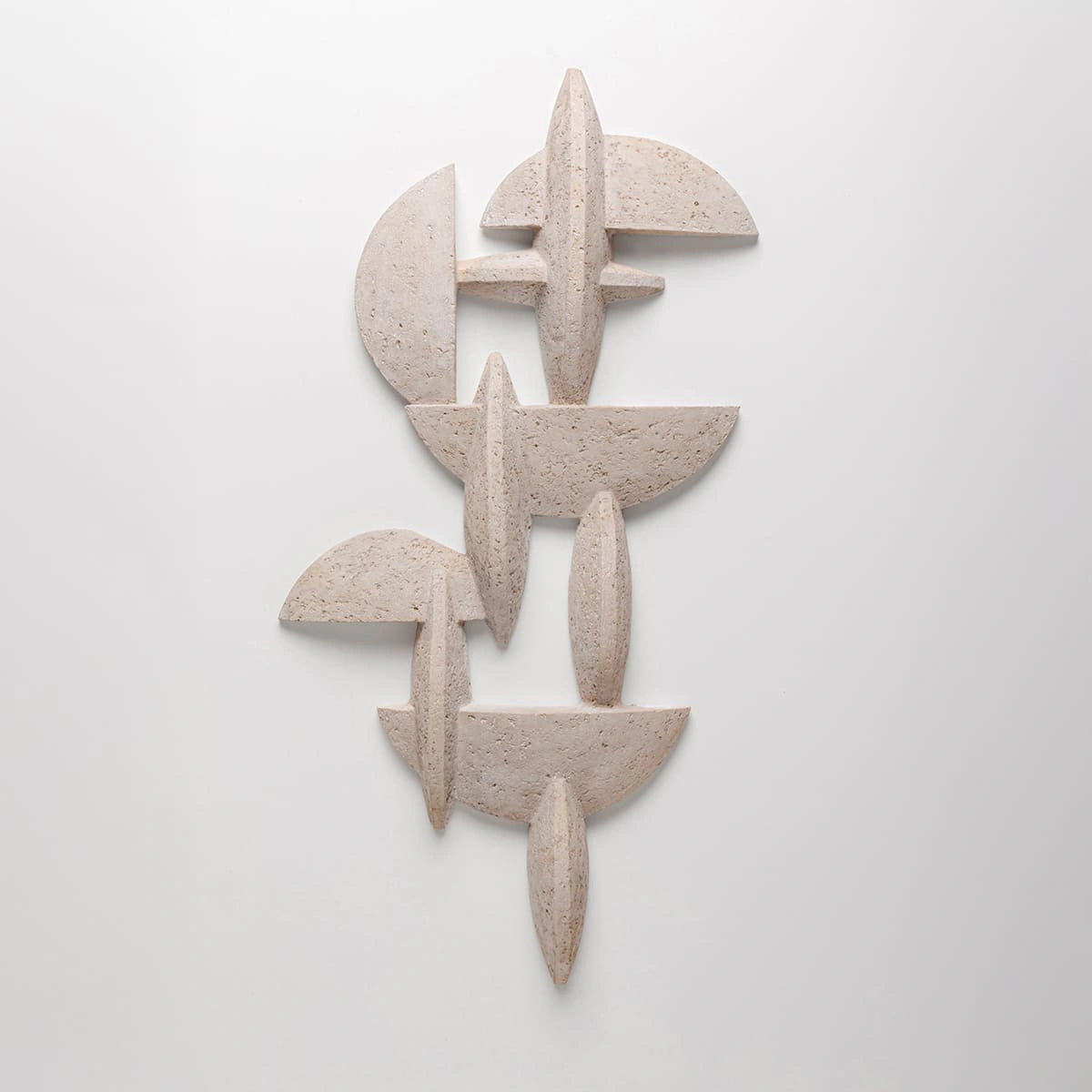 Abstract stone sculpture on a white background