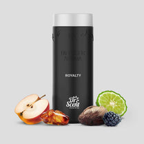 Black diffuser aroma bottle with fruit and spice elements on a light gray background