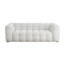 White tufted sofa on a white background