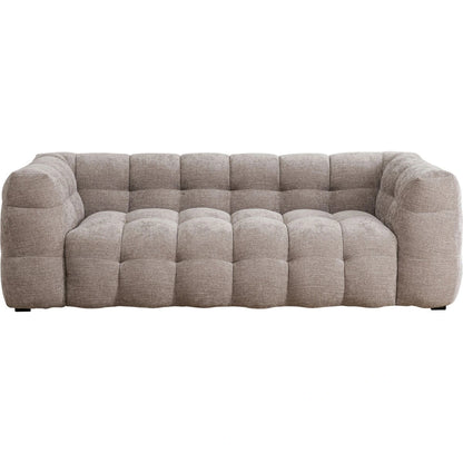 Beige tufted sofa on a white background