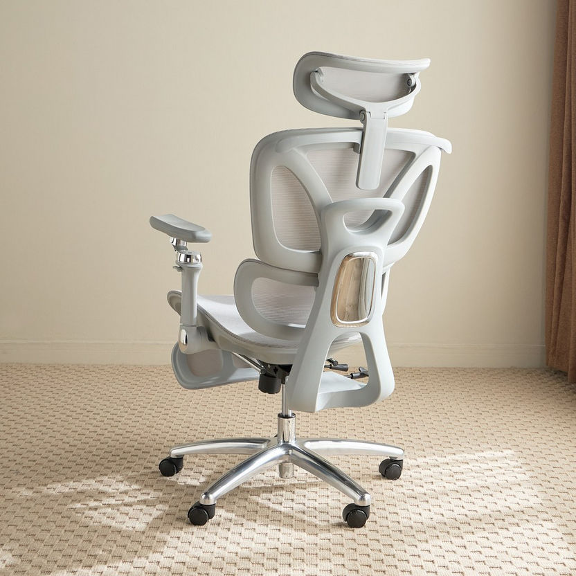 Modern office chair with adjustable features on a beige carpeted floor.