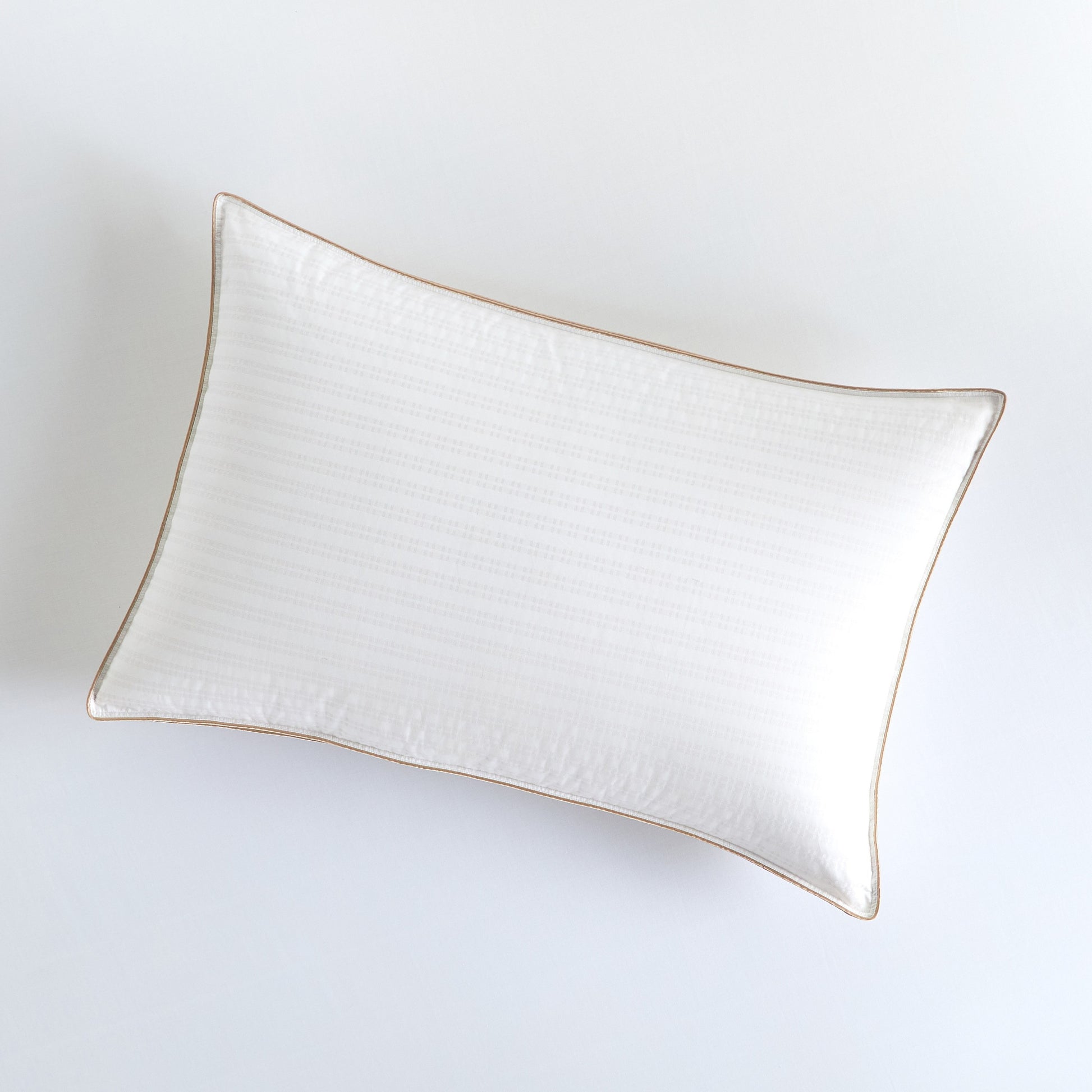 Rectangular ceramic plate with gold rim on a white background