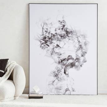 Framed abstract black and white artwork on a wall