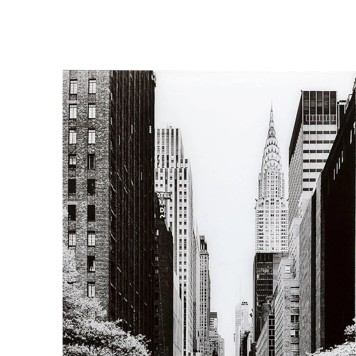 Black and white photo of a cityscape with tall buildings.