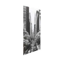 Black and white cityscape with tall buildings and trees on a white background