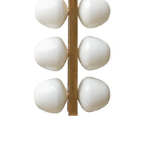 Modern chandelier with white spherical lights on a white background