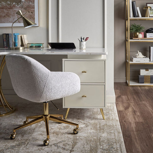 Modern office setup with a desk, chair, and bookshelf.