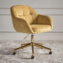 Gold office chair with a textured finish on a wooden floor.