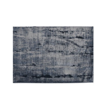 Abstract patterned rug on a white background
