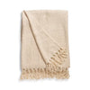 Beige blanket with fringes on a white background
