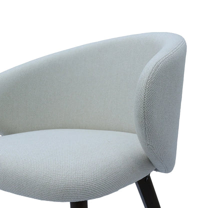 Close-up of a light gray upholstered chair with a white background