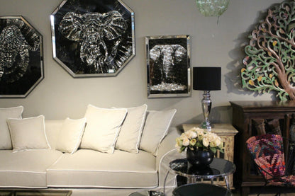 Living room with decorative wall art, a couch, and a lamp. Venice Corner Collection Sofa – Spacious Comfort with Modern Style | Vella Concept