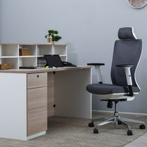 Modern office desk with a chair in a neutral-colored room