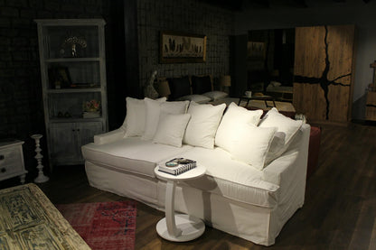 Living room with a white sofa, side table, and decorative items. Bodrum Collection Sofa – Elegance Meets Everyday Comfort | Vella Concept