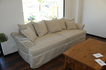 Beige sofa in a living room with a wooden coffee table. Bosphorus Collection Sofa – Minimalist Elegance for Modern Homes | Vella Concept