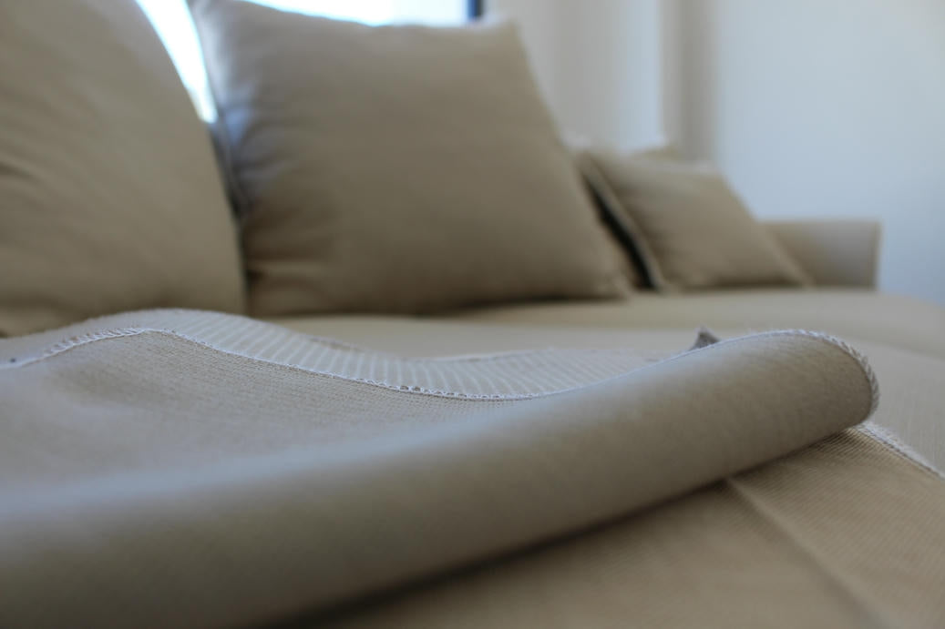 Close-up of a beige sofa with a focus on the fabric texture. Bosphorus Collection Sofa – Minimalist Elegance for Modern Homes | Vella Concept