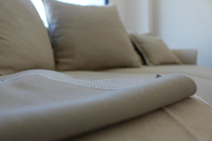 Close-up of a beige sofa with a focus on the fabric texture. Bosphorus Collection Sofa – Minimalist Elegance for Modern Homes | Vella Concept