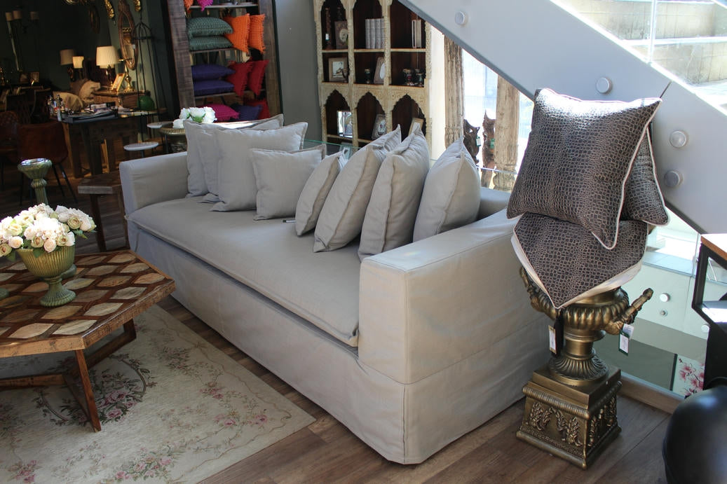 Living room with a beige sofa, decorative pillows, and a coffee table. Cappadocia Collection Sofa – Simple, Serene & Timeless | Vella Concept