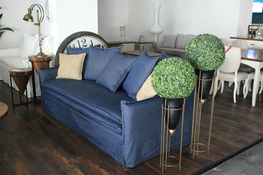 Blue sofa with decorative pillows in a living room setting - Istanbul Collection Sofa – Minimal Touch, Maximum Comfort | Vella Concept