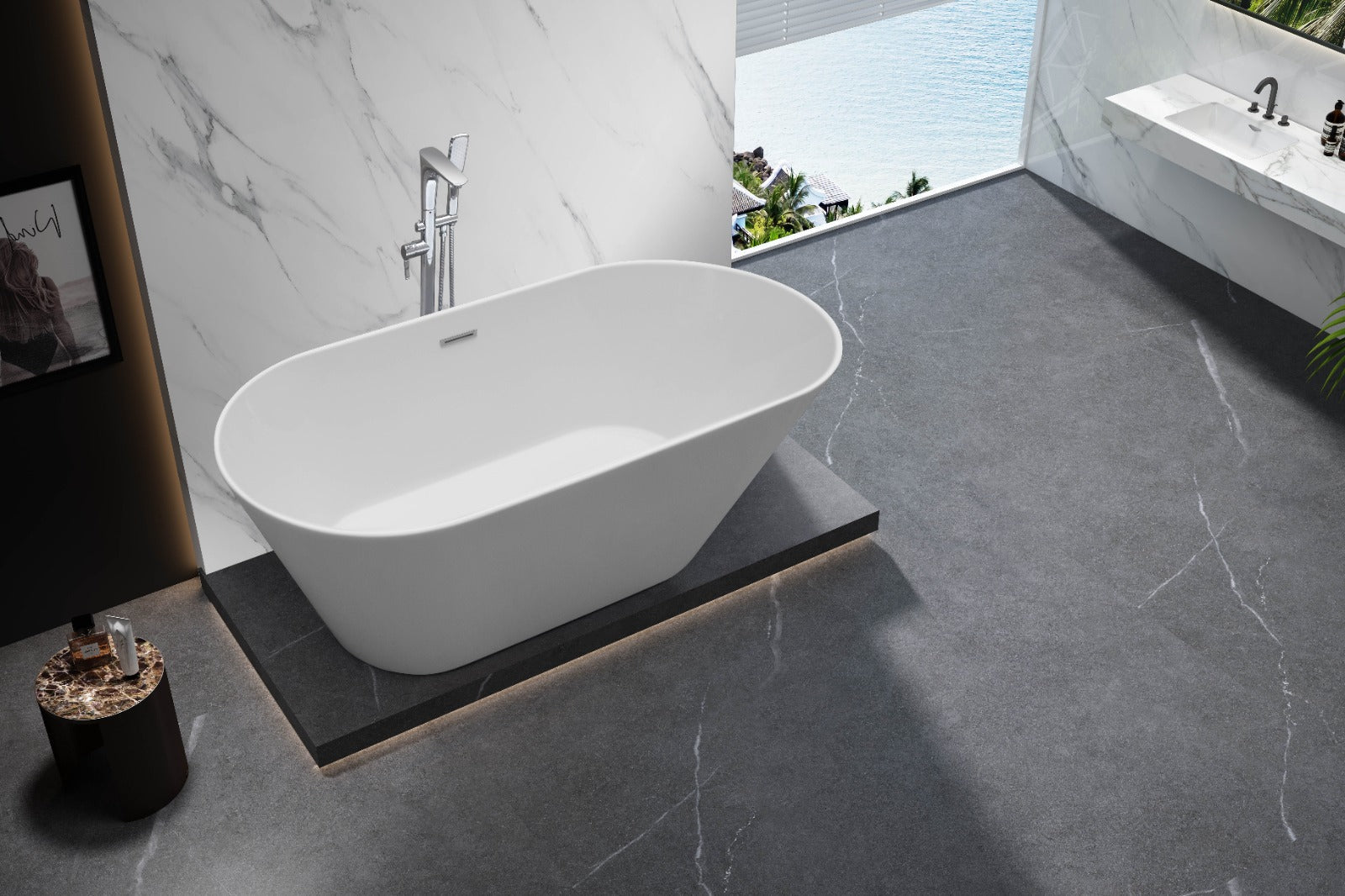 Modern bathroom featuring an acrylic freestanding bathtub on a raised platform, with gray stone flooring, marble walls, and a large window overlooking water. A sink and potted plant are visible in the background.