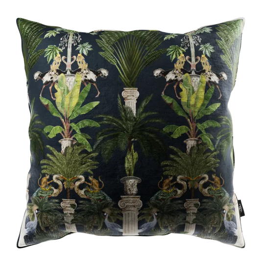 The Cushion Tropical columns (dark) is a square, velvety soft cushion with a dark backdrop and a symmetrical pattern of lush tropical plants, ornate columns, monkeys, and foliage in rich green and gold—ideal for mysterious, stylish interiors.